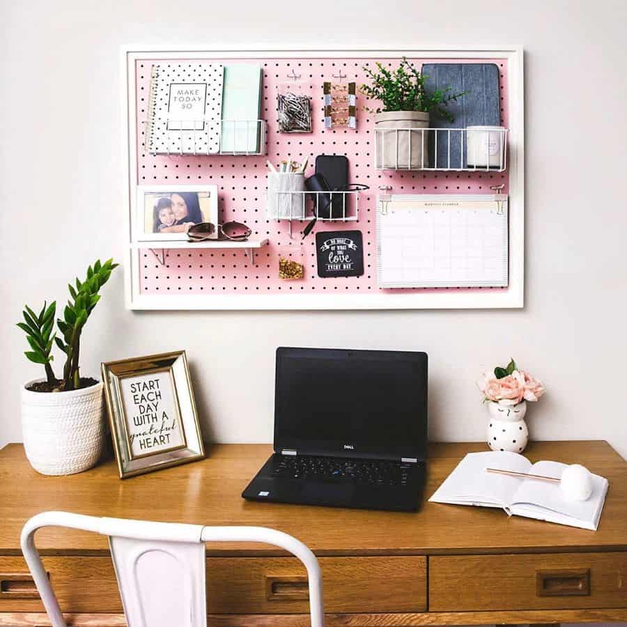pink pegboard wall storage home office wood desk white chair