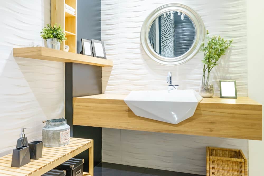 textured white wall with wood vanity powder room