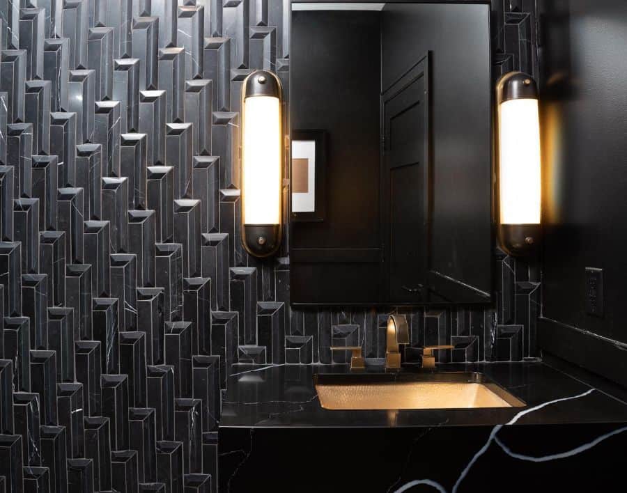 black wall powder room with gold accents 