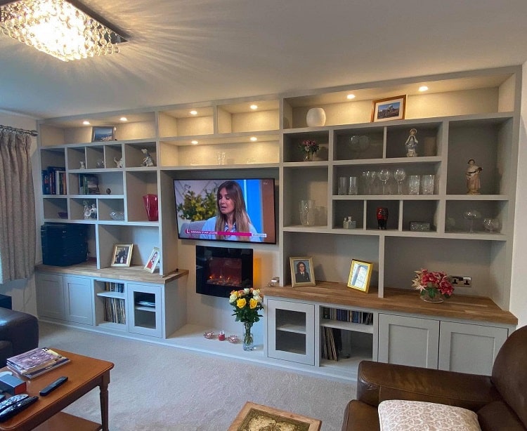 white shelves and cabinets fireplace tv 