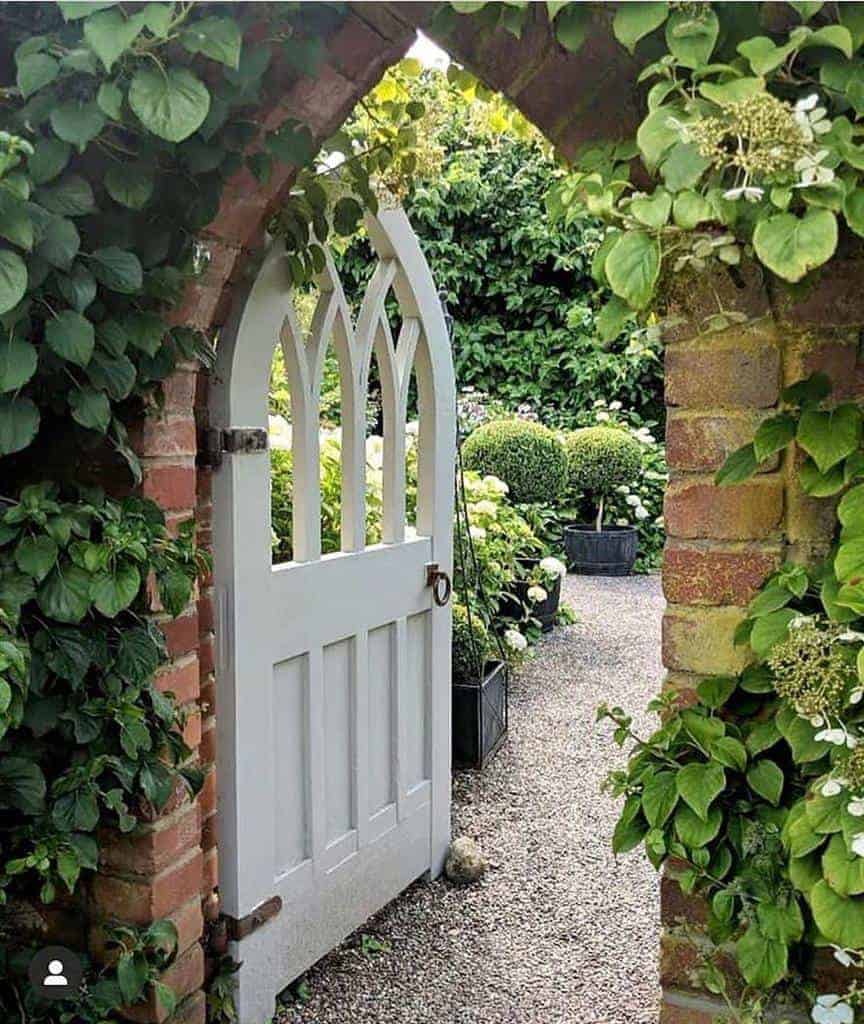 walled garden white gate backyard