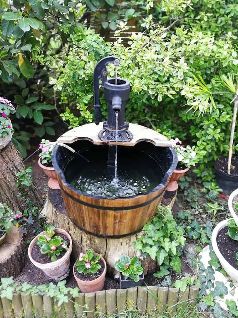 wood barrel water feature backyard