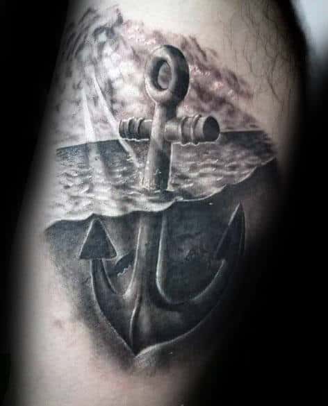 Tattoo of a submerged anchor in water on an arm with detailed shading and textures