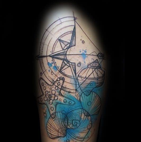 Sketch-style tattoo with a starfish, seashells, compass, and blue watercolor splashes, creating a playful nautical design on the arm.