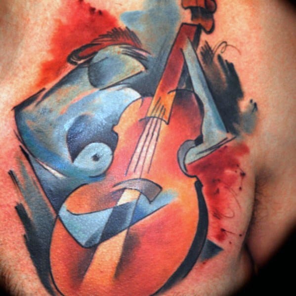 Bold and abstract chest tattoo of a violin intertwined with a stylized nude figure, using vibrant watercolor shades and cubist-inspired shapes.