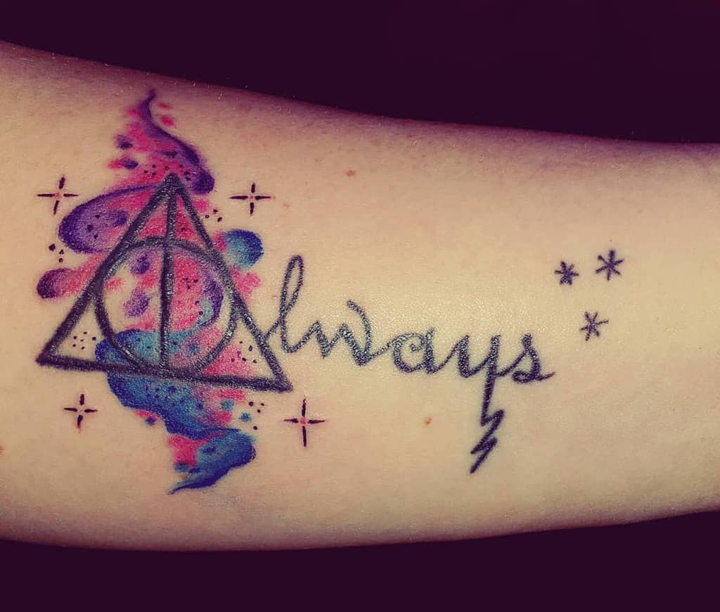 Harry Potter-themed tattoo with 'Always,' the Deathly Hallows symbol, lightning bolt, and vibrant watercolor accents