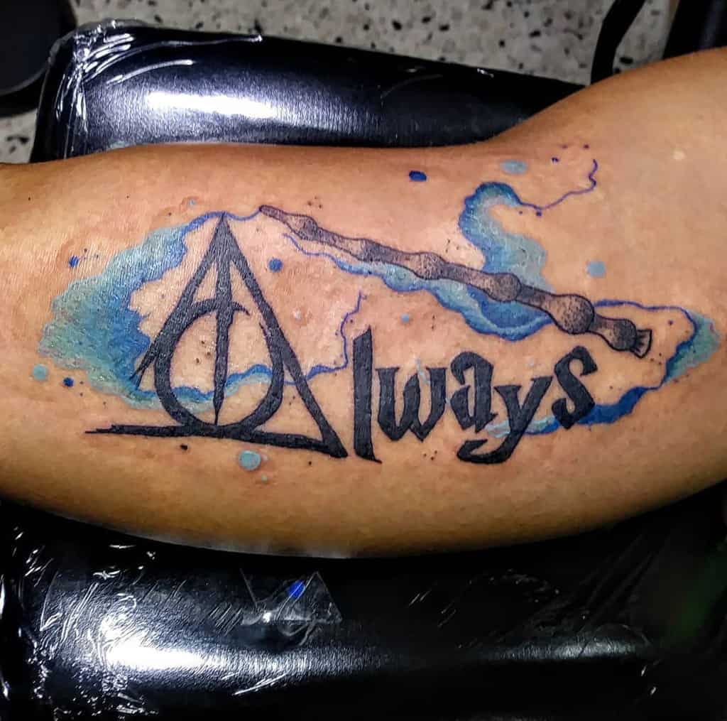 Harry Potter-inspired tattoo with 'Always,' Deathly Hallows symbol, Elder Wand, and blue watercolor magic accents