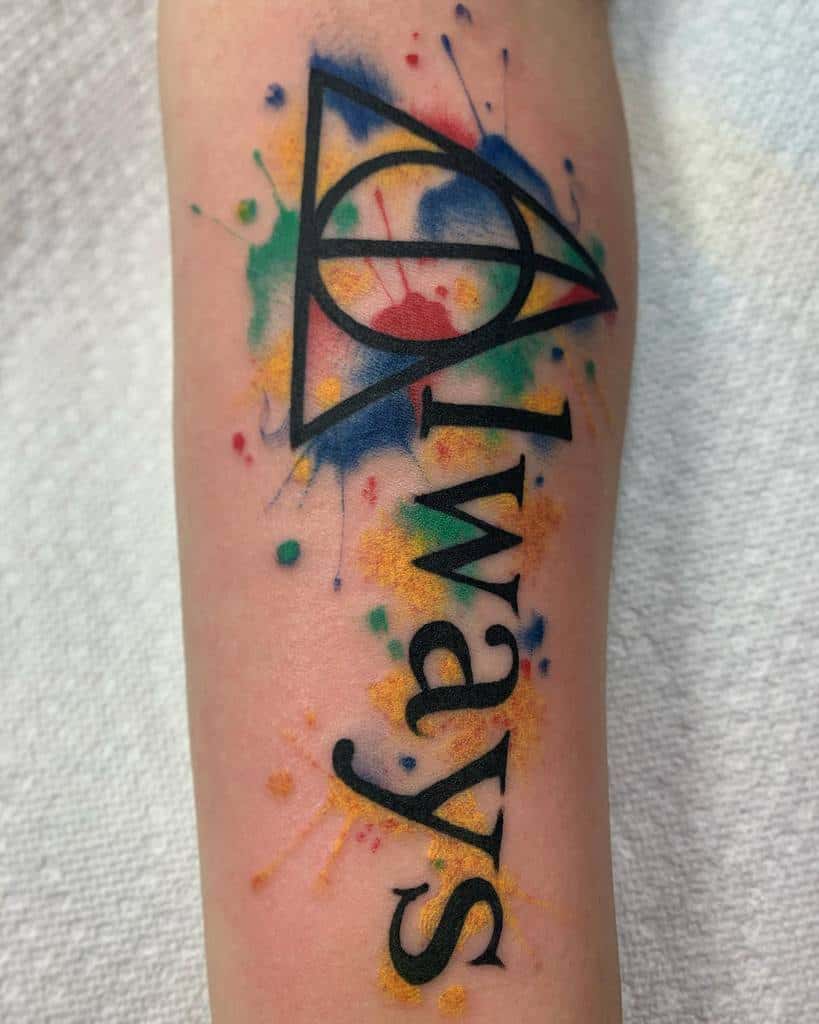 Bold 'Always' tattoo with the Deathly Hallows symbol and colorful watercolor splashes, representing magic and loyalty