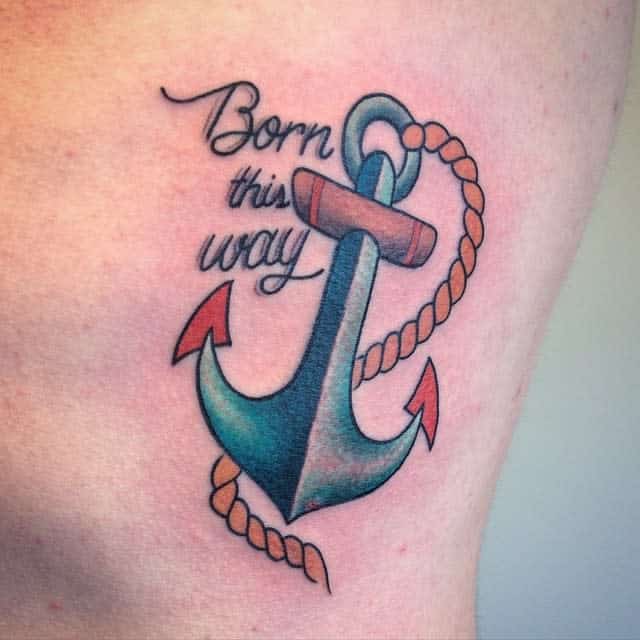 Colored anchor tattoo with rope and "Born this way" text on skin