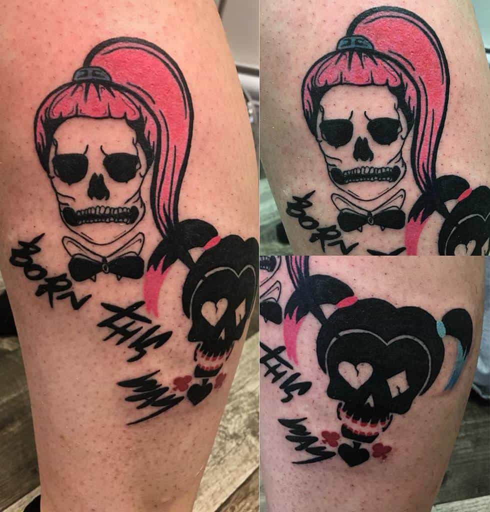 Tattoo of a skeleton girl with pink hair, text "Born This Way," and heart details on an arm
