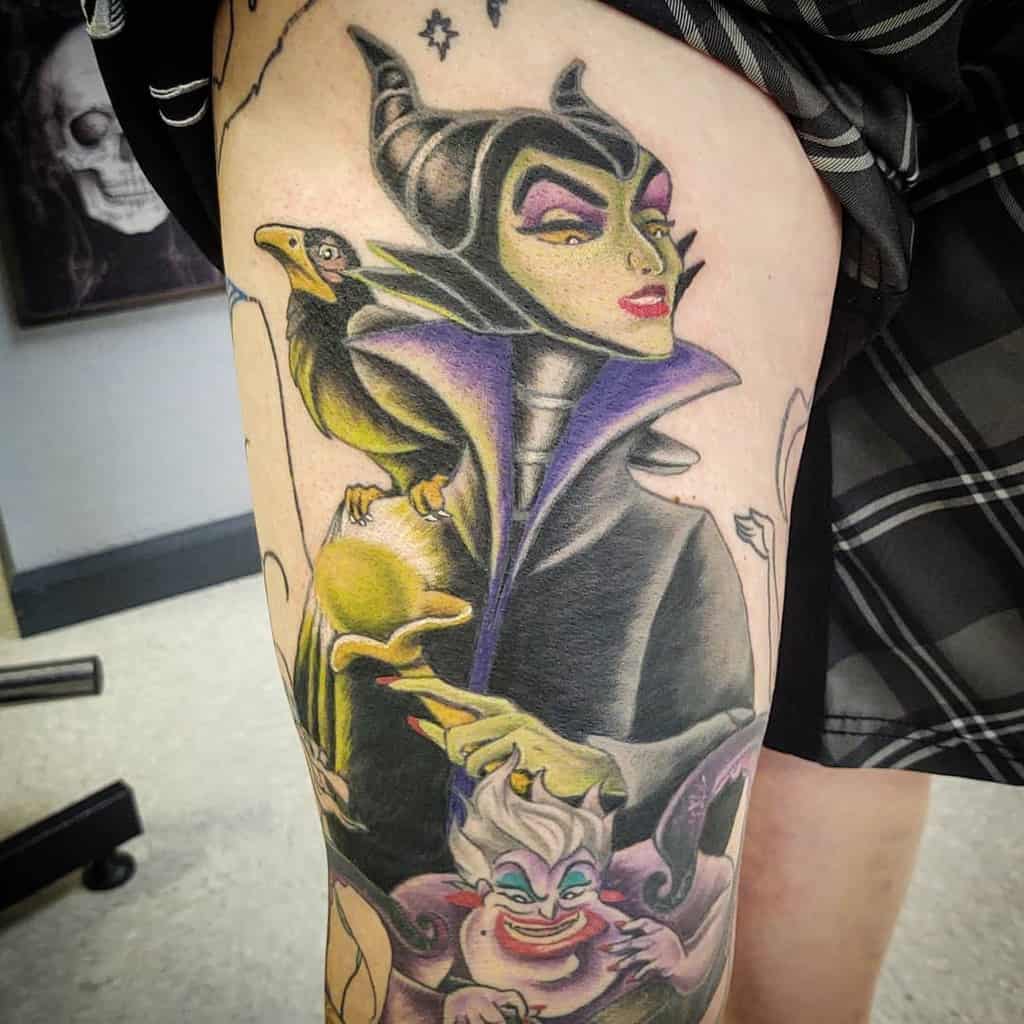 Bold and colorful Maleficent thigh tattoo featuring intricate shading and vibrant hues, capturing her wicked elegance alongside Ursula