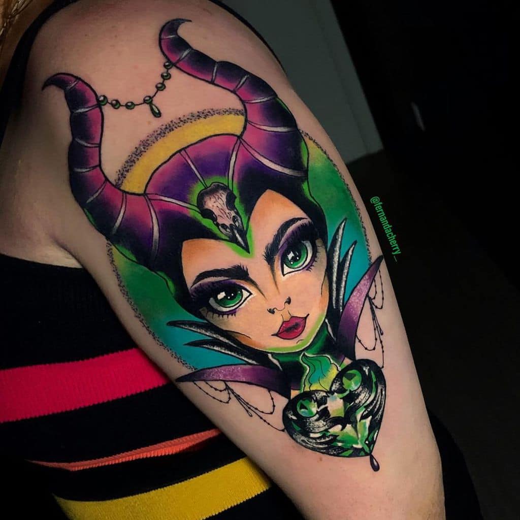 Vibrant Maleficent tattoo with bold colors and striking green eyes, blending fantasy and elegance in a mesmerizing design