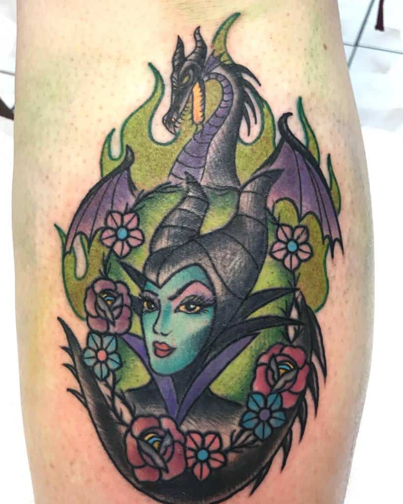 Vibrant Maleficent and dragon tattoo with a mix of bold outlines, rich shading, and floral elements, bringing a mystical fairytale vibe
