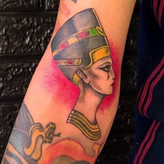 Tattoo of an Egyptian queen with a headdress on an arm