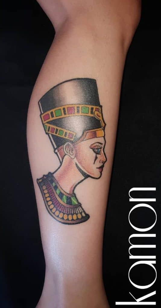 Colorful tattoo of an ancient Egyptian figure on a leg