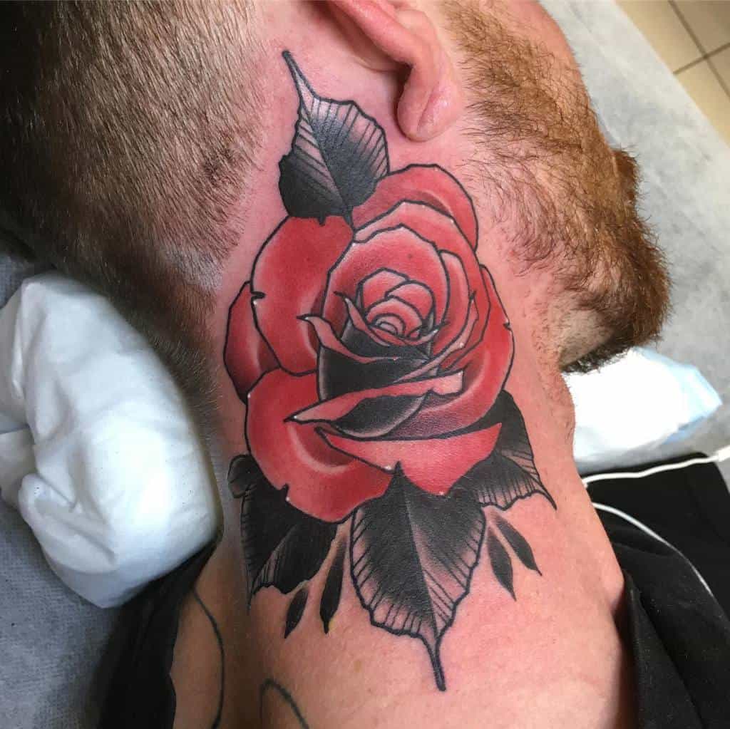 Red rose tattoo on a man's neck with black shading and green leaves