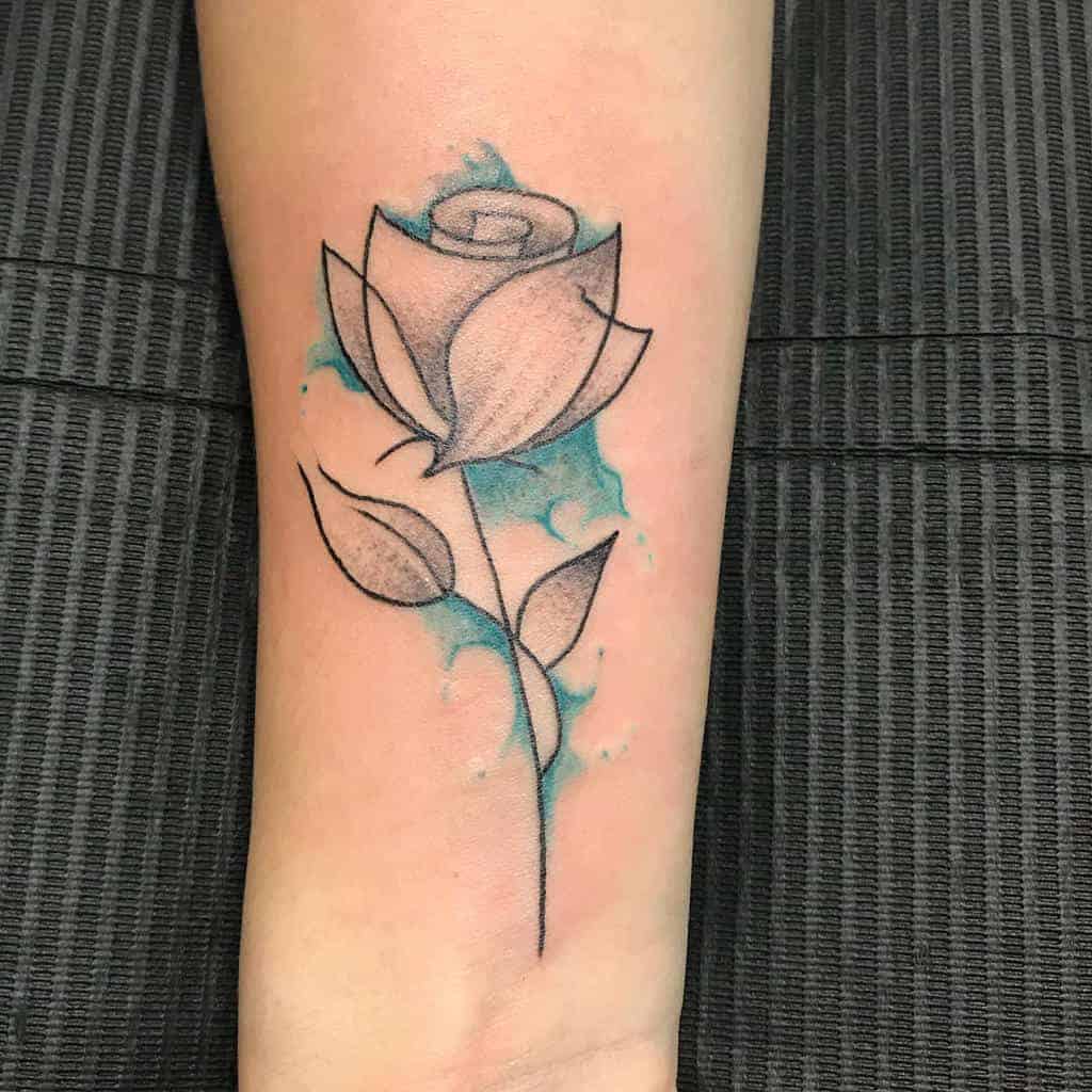 A simple rose tattoo with blue shading on an arm
