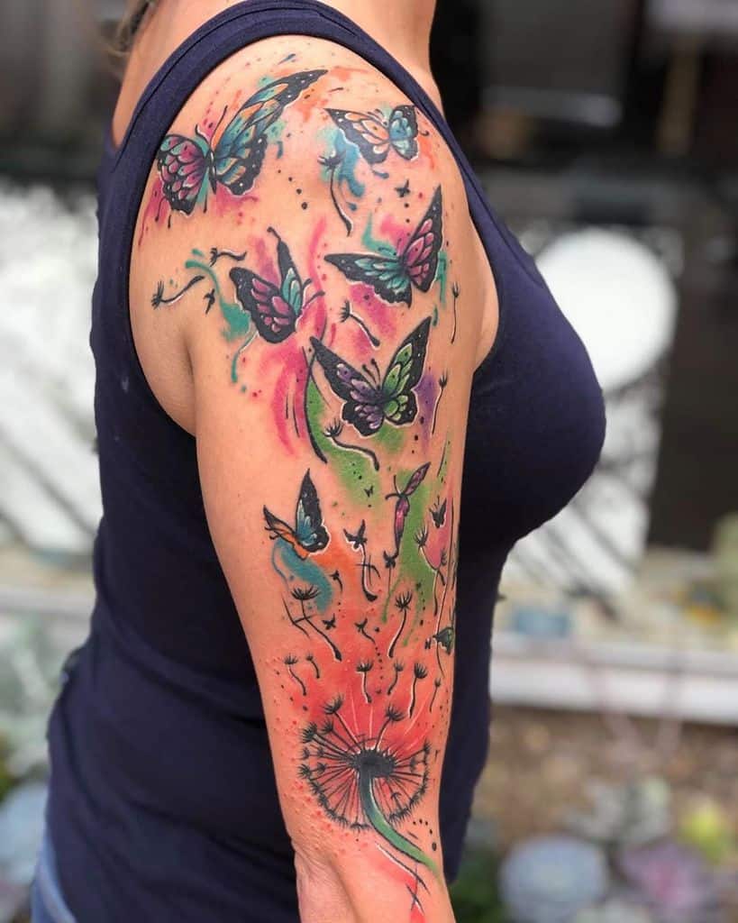 This tattoo beautifully combines vibrant butterflies and a dandelion, symbolizing freedom and transformation. The colorful design creates a dynamic flow from the dandelion, evoking a sense of lightness and movement.
