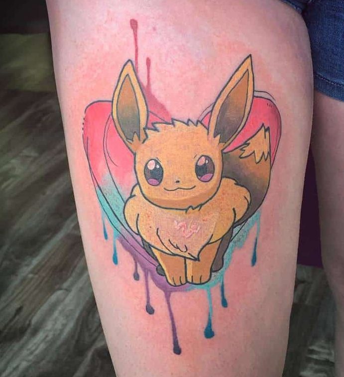 Adorable Eevee tattoo with a vibrant heart-shaped watercolor background featuring soft pink, blue, and purple drips