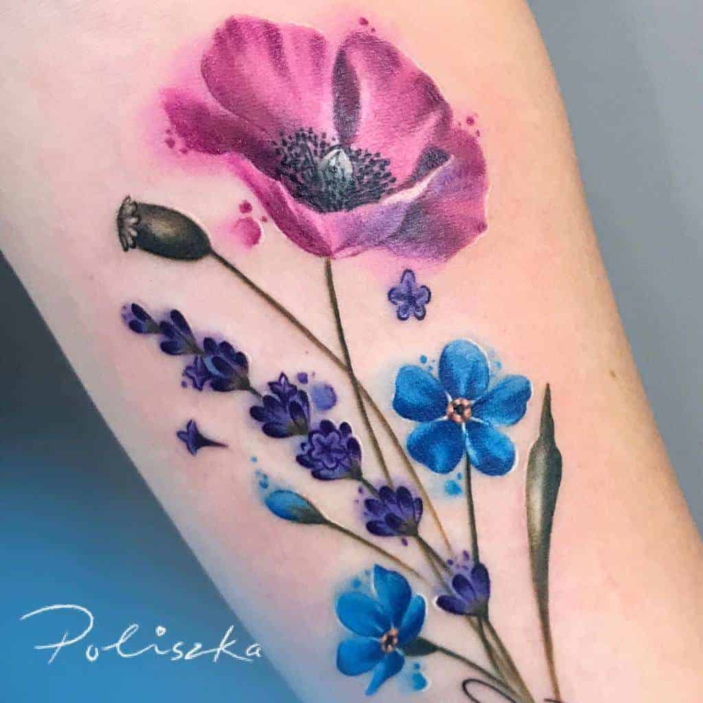 A vibrant watercolor tattoo featuring a stunning pink flower and delicate blue forget-me-nots, capturing beauty and grace