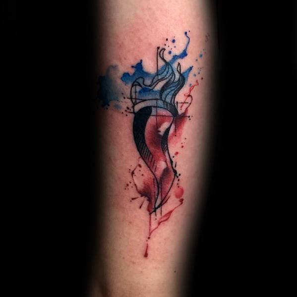 Artistic Italian horn tattoo with watercolor splashes in red and blue, blending abstract and traditional elements for a unique design.