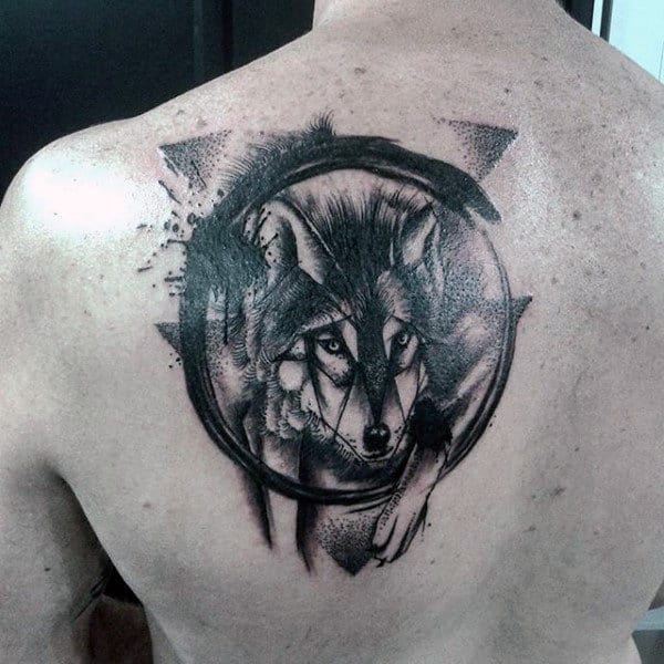 Back tattoo of a wolf in a circular frame with geometric elements and artistic shading