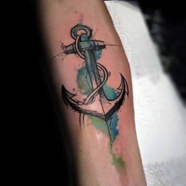 Anchor tattoo with vibrant watercolor splashes on an arm