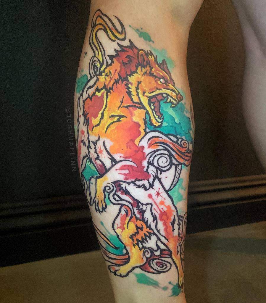Vibrant watercolor Okami tattoo featuring a fierce, fiery beast with swirling divine energy, blending bold reds, oranges, and blues in a dynamic design