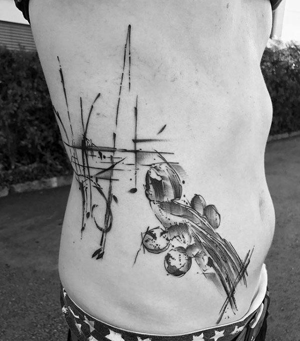 Watercolor Rib Cage Side Male Music Staff Tattoo Design Inspiration
