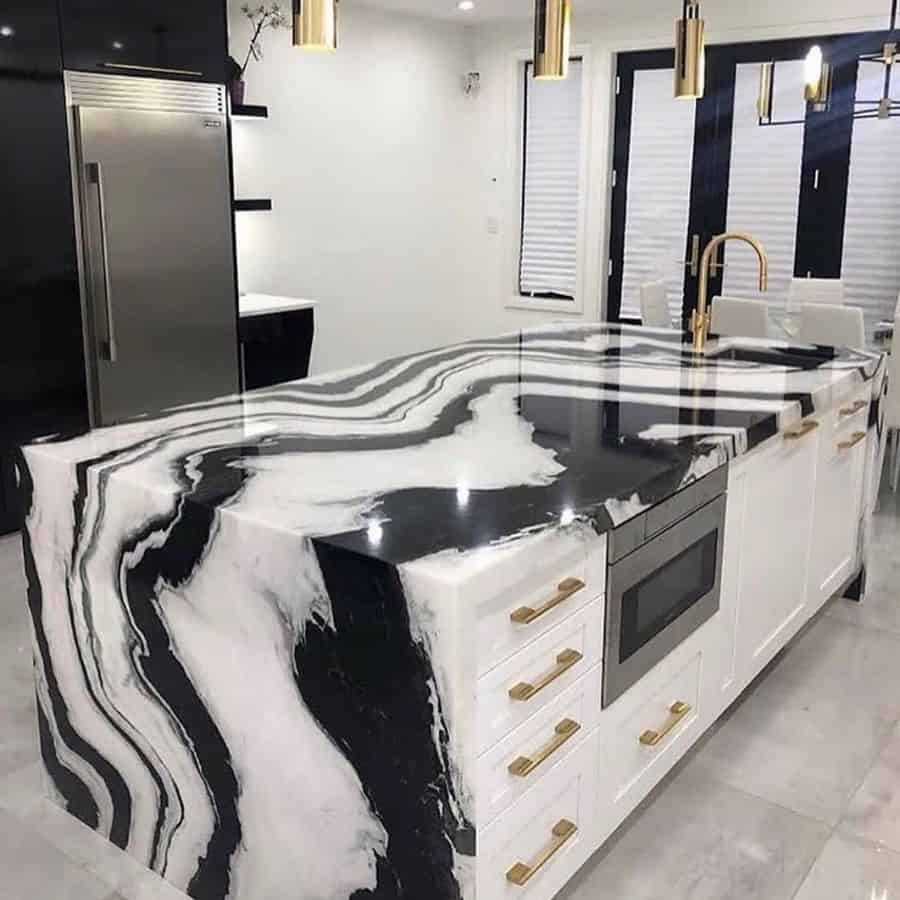 black and white marble countertop kitchen island with gold accents