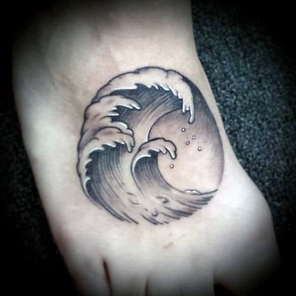 Waves Inside Circular Stamp Tattoo On Foot