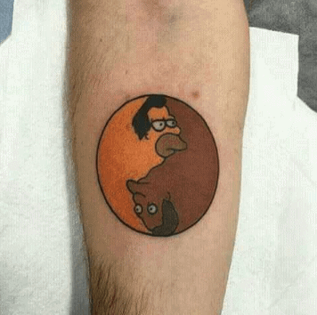 A colorful tattoo featuring two cartoon characters forming a yin-yang symbol, blending humor with balance in a circular design.