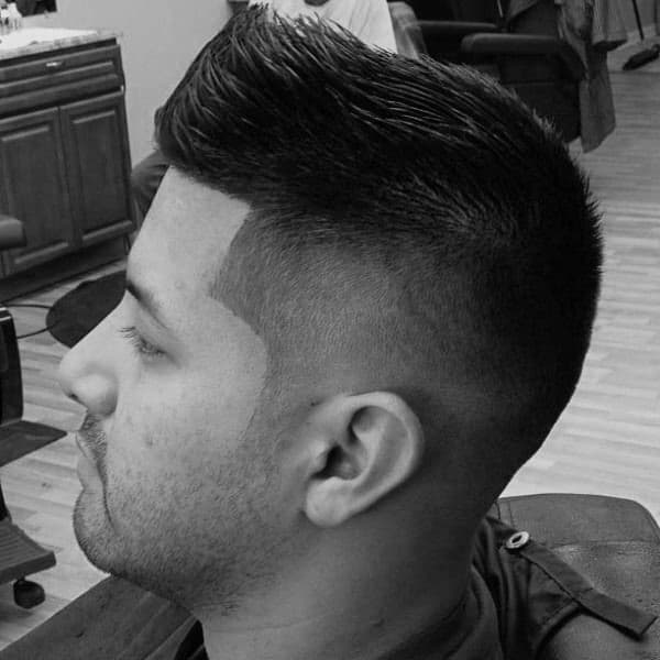 Well Groomed Mens Faux Hawk Fade Hairstyle Taper