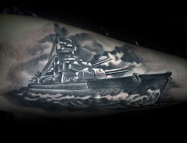 Battleship tattoo masterfully detailed in grayscale on a person's arm