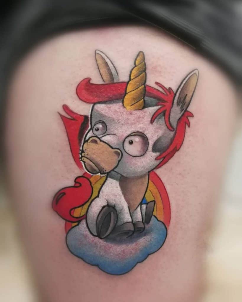 Colorful cartoon-style tattoo of a goofy unicorn with wide eyes, sitting on a cloud with a rainbow background, featuring bold shading and vibrant hues.