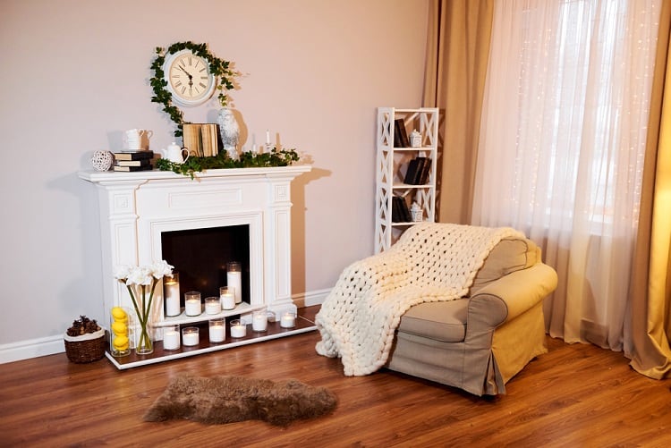 white fireplace with candles in living room