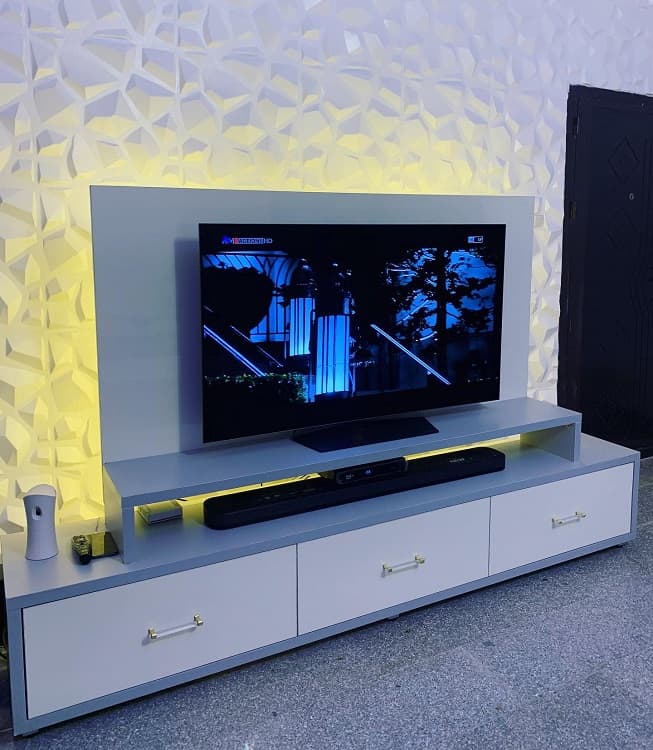 white console textured wall modern entertainment center tv