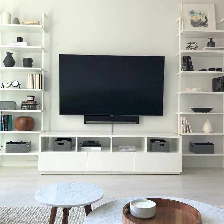 white shelving and cupboards wall mounted tv marble tables
