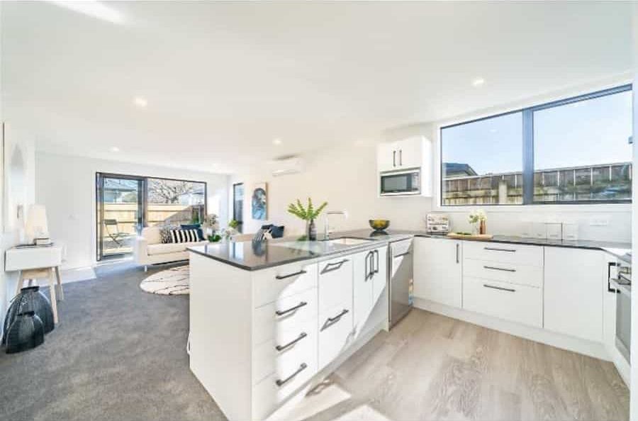 white farmhouse kitchen open plan living room white cabinets white sofa