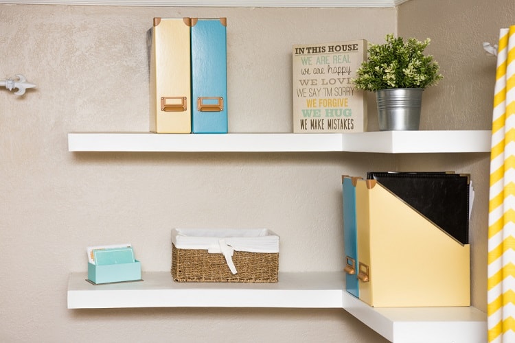 white floating corner open shelving