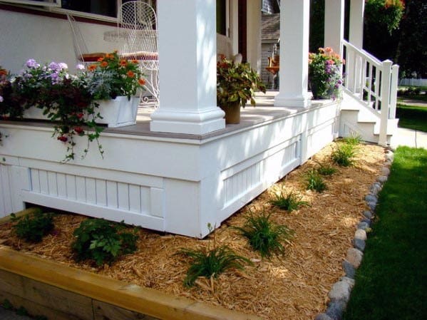 white front porch deck skirting pot plants