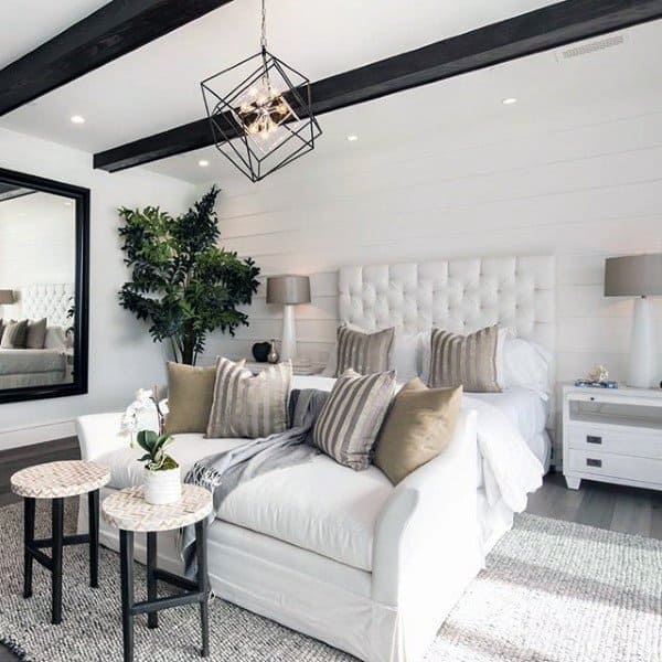 modern home shiplap walls black accents white upholstered headboard white couch