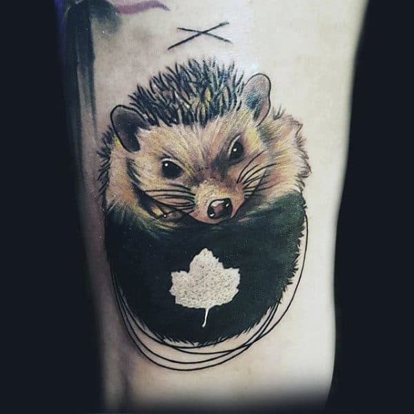 White Ink Leaf Tattoo On Man With Hedgehog In Color