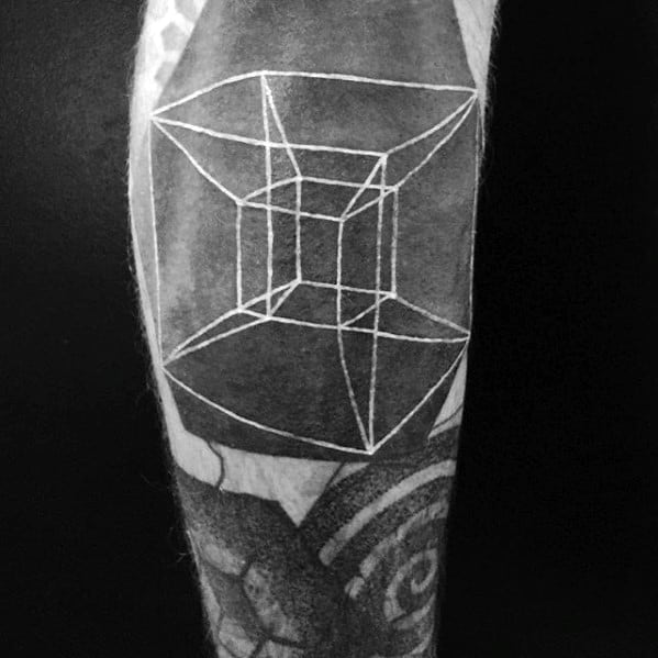 Black and white blast over tattoo of a hypercube on an arm