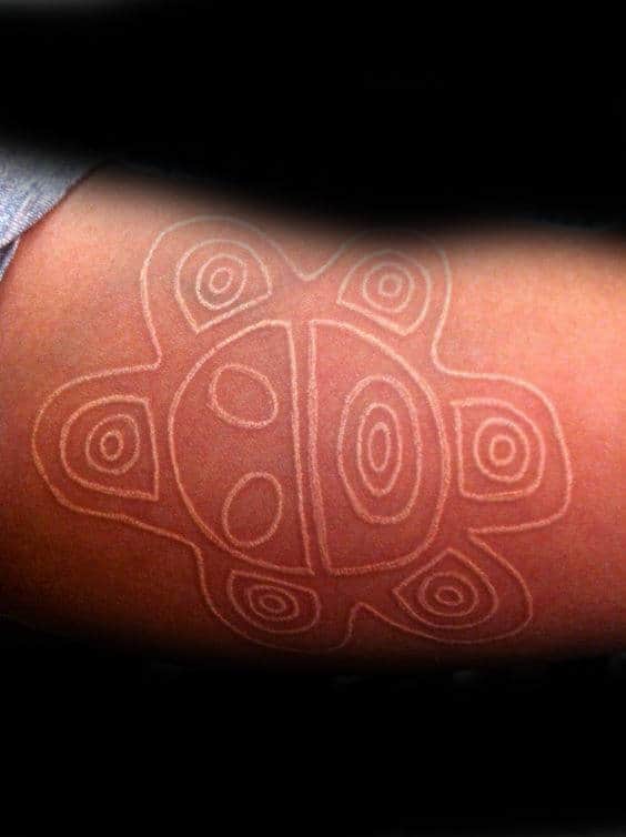 White Ink Taino Sun Tattoo For Guys On Biceps