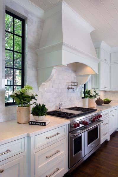 arched white kitchen hood in country style kitchen