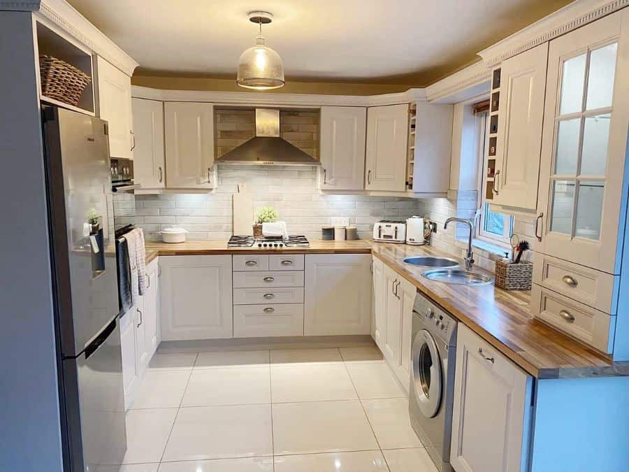 white rustic kitchen wood countertop glossy white floor tiles