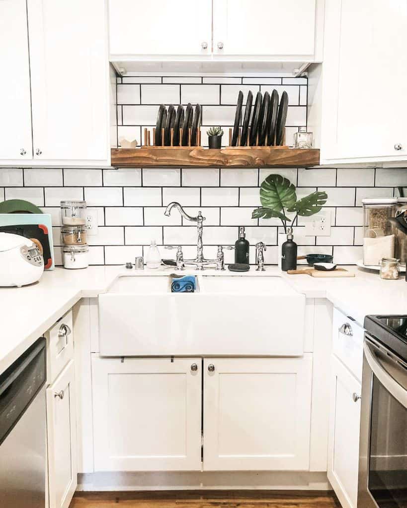 white kitchenette apron sink white tile backsplash