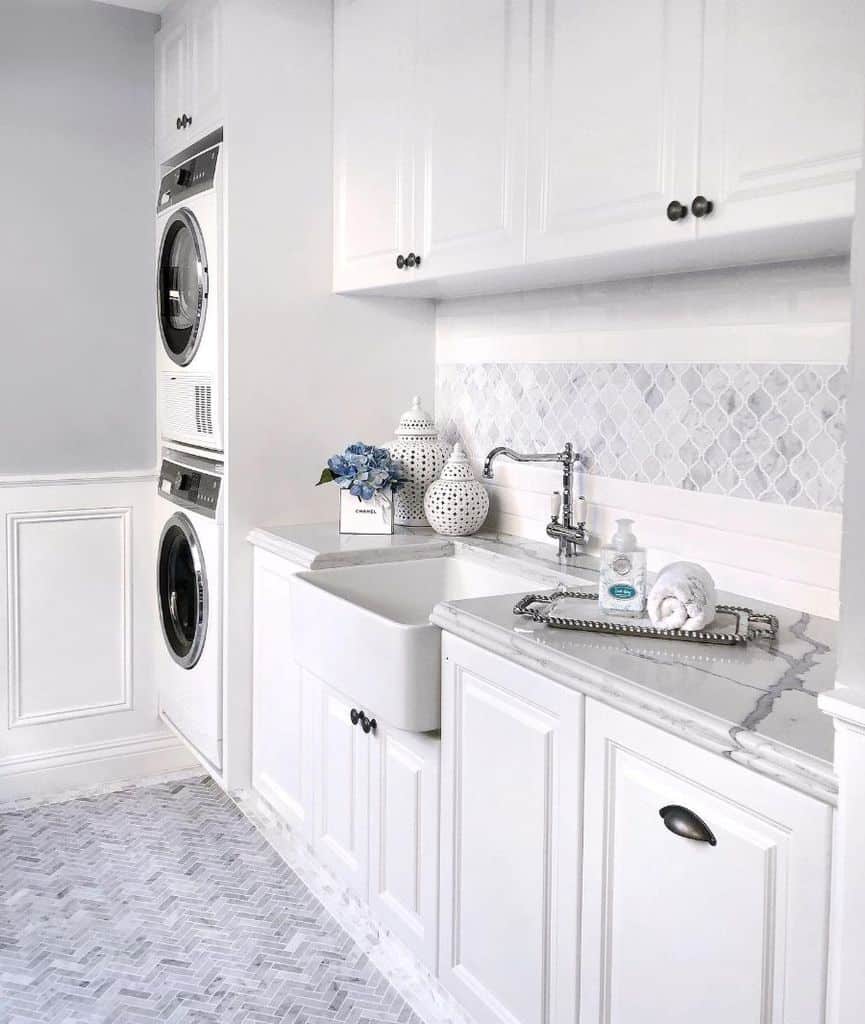 large luxury white laundry apron sink vertical washer and dryer