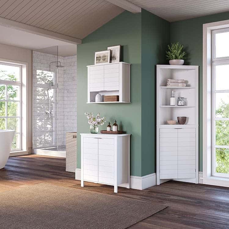 white linen corner cabinet green wall 